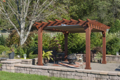 Wooden pergola with an EZShade canopy.