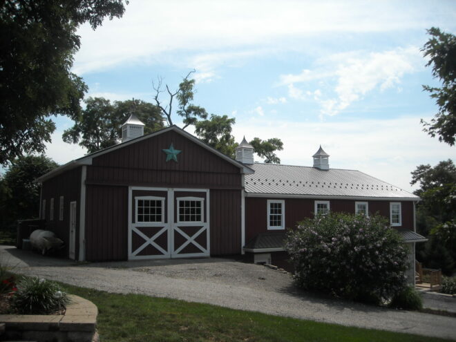 Three Norwood cupolas on barn.