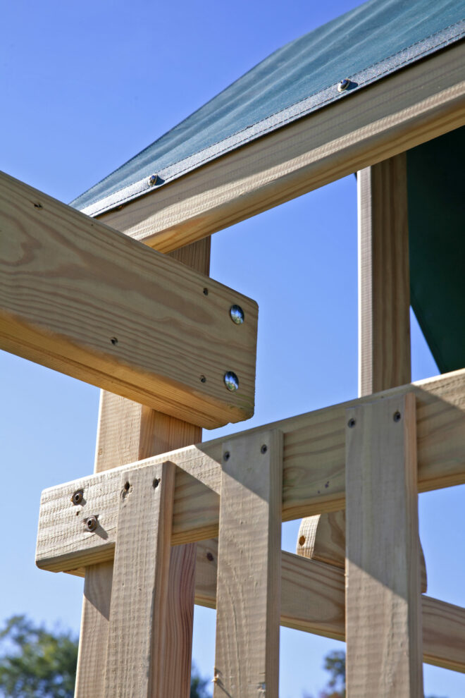 Playset swing beam closeup.