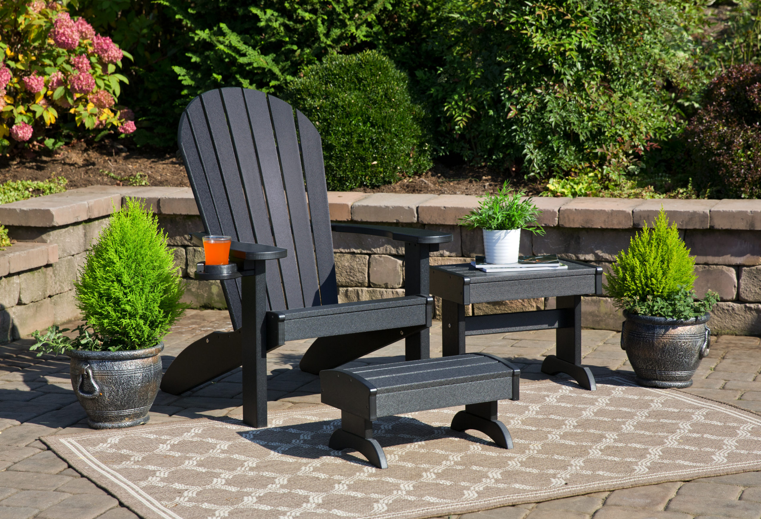 Black poly Adirondack chair, side table, footstool.