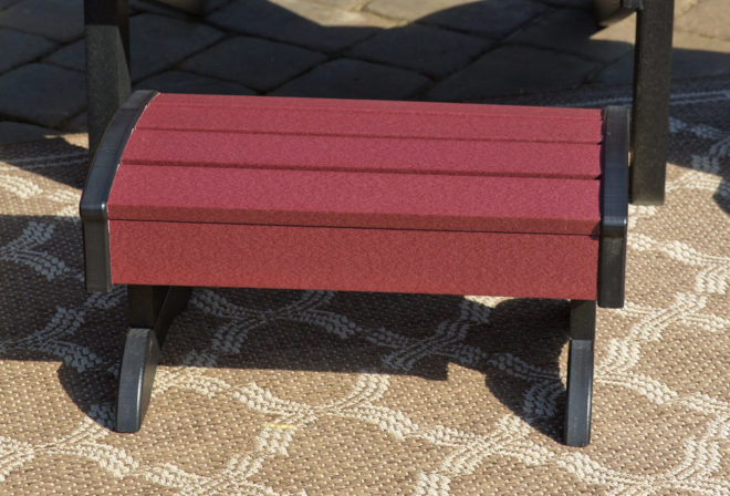 Cherry and black poly footstool.