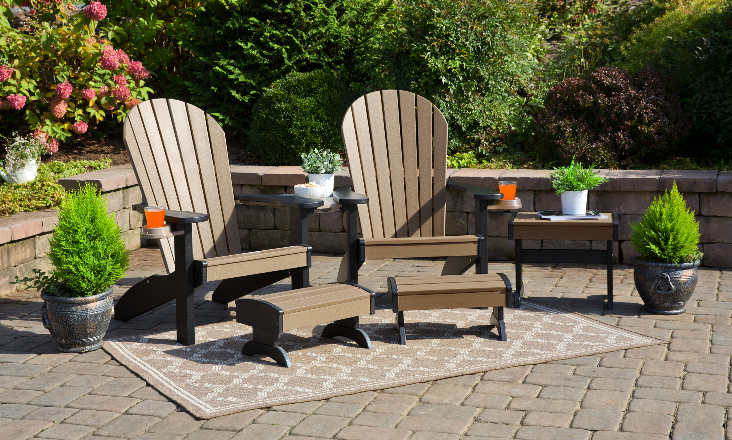 Weathered poly wood and black Adirondack companion chair set.