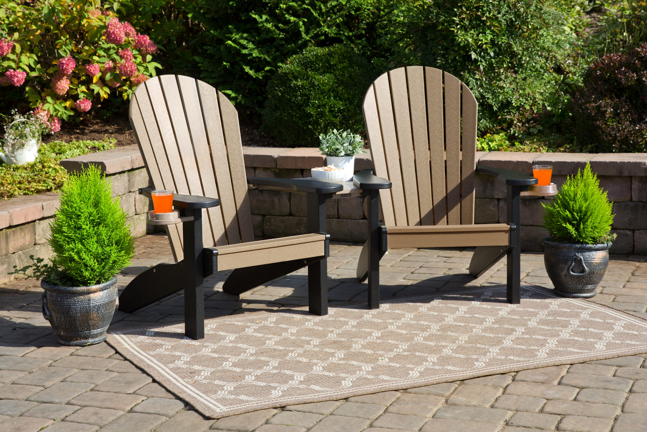 Weathered poly wood and black Adirondack companion chair set.