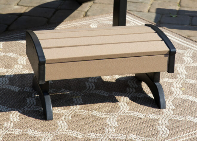 Weathered poly wood and black footstool.