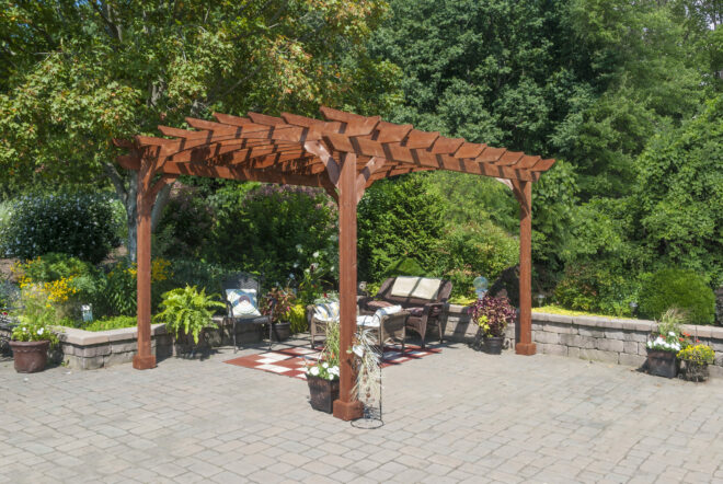 A wooden pergola shading a sitting area.