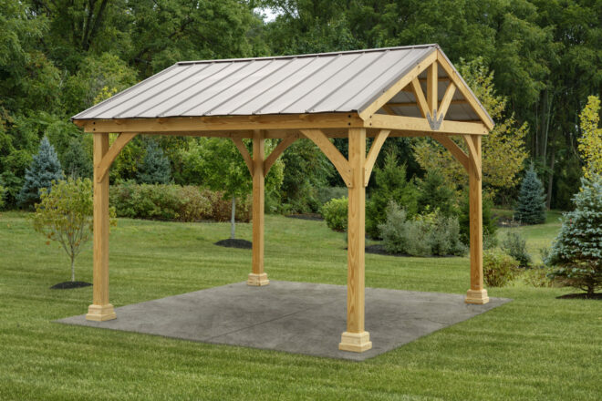 An a frame pavilion set in a garden.