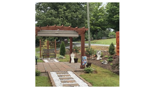 A traditional pergola with an EZShade canopy.