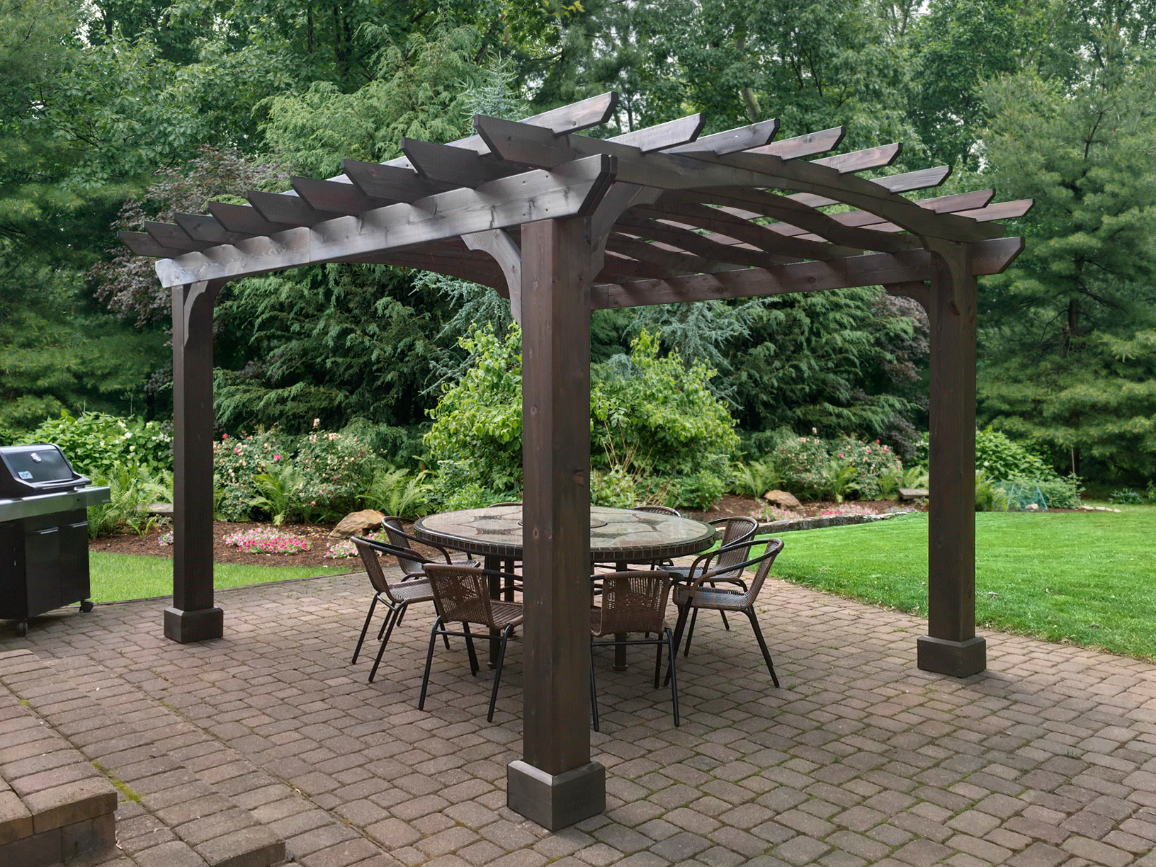 Traditional pergola shading a round dining table.