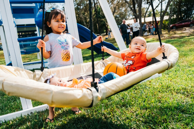 Kids on swings.