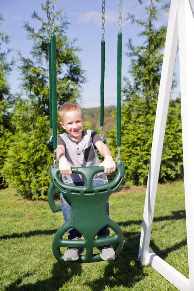 A kid on a swing.