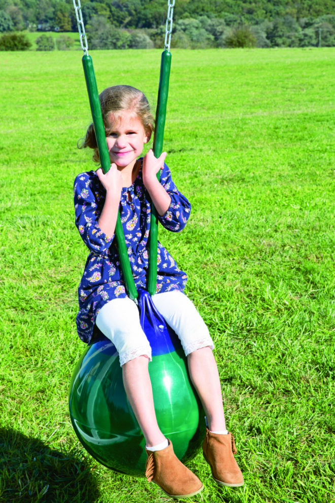 A kid on a swing.