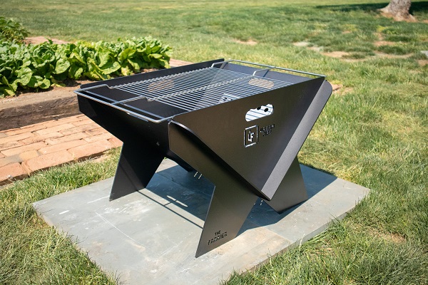 Farrier firepit with rectangle cooking grill grate.