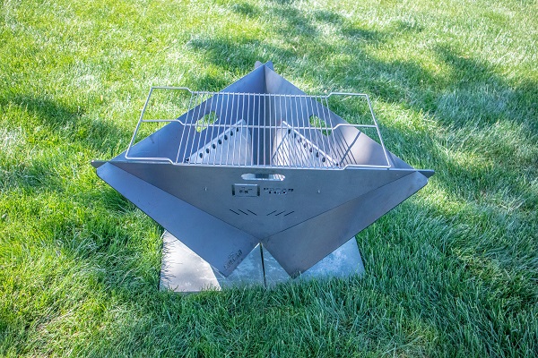 Vulcan collapsible firepit with grill grate.